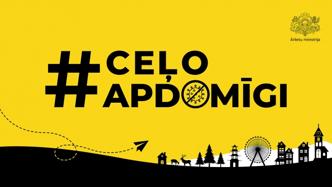 uzraksts #Ceļo apdomīgi uz dzeltenā fona