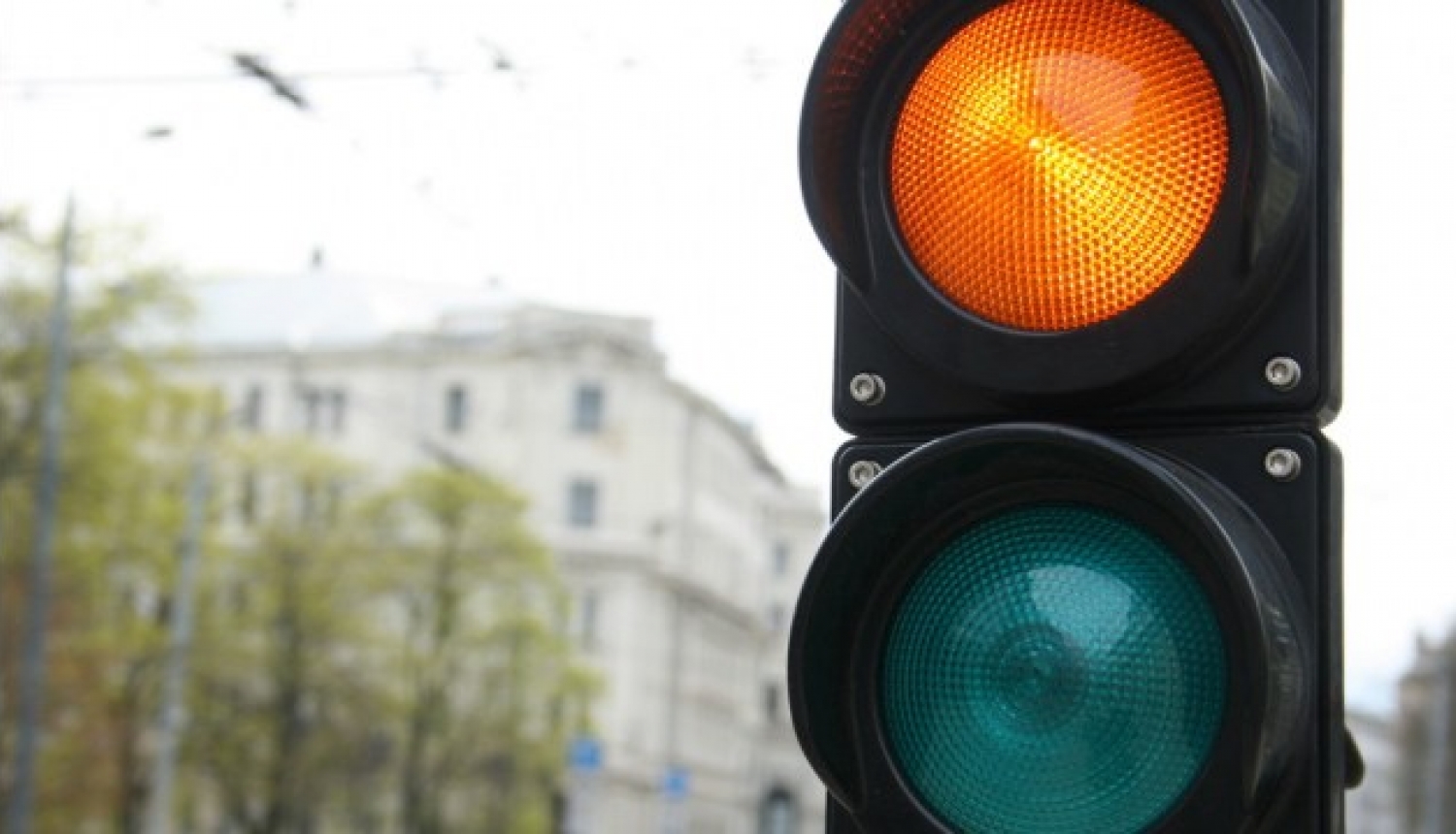 Traffic light with yellow and green lights